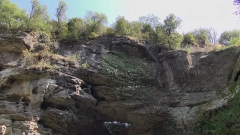 Foradada cliff stone rock day sunlight trees tunnel gorge mountain pass ravi Stock Footage 329768754