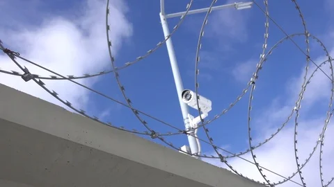 Forbidden territory behind the barbed wire Stock Footage 87179608