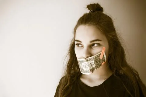 Forced silence, bribery. Stock Photos