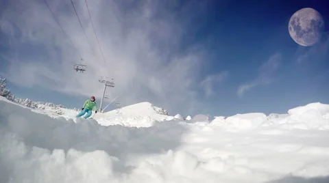 Forceful dynamic footage of a skier going down the snowy slope on a sunny day Stock-Footage 55197100