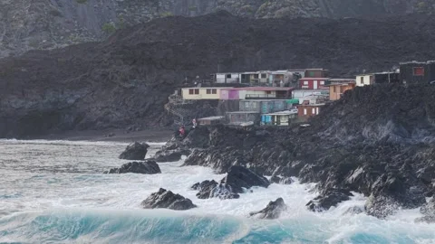 Forceful waves battering dark volcanic rocks along La Palma shoreline, dramatic 스톡 동영상 308406488
