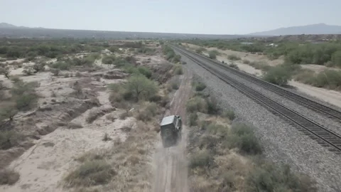 Ford Bronco navigating an unpaved track in the desert Stock Footage 192541133