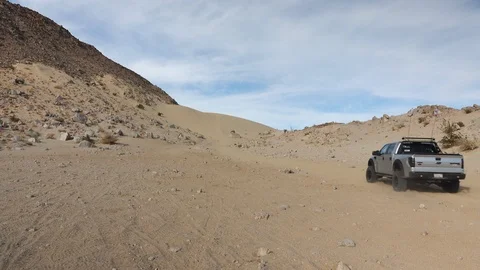 Ford F-150 Raptor SVT driving up the Stock Video Pond5