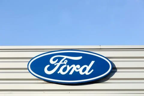 Ford logo on a facade of a dealer Stock Photos