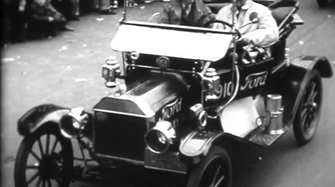 Ford Model-T & Others Drive Through City - Vintage 8mm Stock Footage