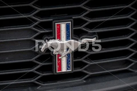 Ford Mustang car logo on the retro hood. Stock Photos