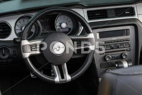 Ford Mustang retro car wheel and dashboard Stock Photos