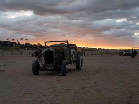Ford old timer car standing on the be Stock Photos
