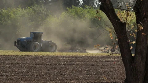 Ford Tractor Discing Under a Corn Field Stock Footage