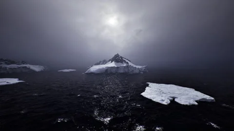 Foreboding icy sea with turbulent waves and looming storm clouds overhead Stock Footage 338336853