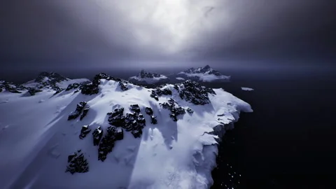 Foreboding landscape featuring stormy sky and rough shoreline as background Stock Footage 343612313