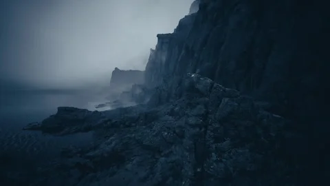 Foreboding shoreline with turbulent sea and thick clouds above Stock Footage 331519893