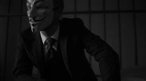 Foreboding shot of Anonymous hacker man in prison (B/W Version) Stock Footage 60580027
