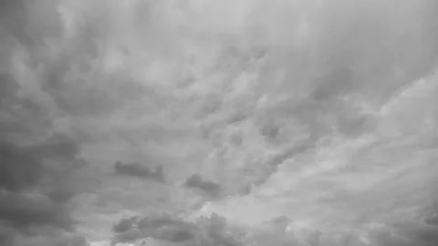 Foreboding sky filled with swirling storm clouds creates dramatic tension, Inten Stock Footage 325640744
