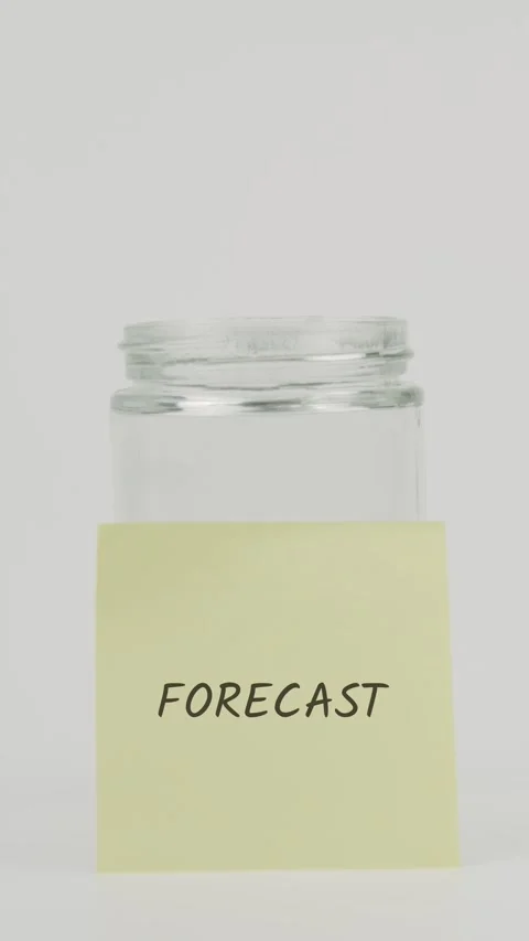 Forecast text or word on yellow sticky note attached to glass jar with hand Stock Footage 311735749