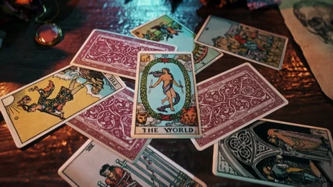 Forecasting luck and successful fate by reading the mysterious The World card Stock Footage 250780971