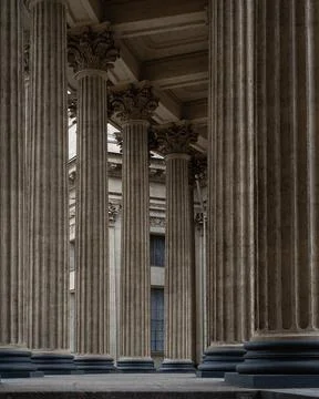 In the foreground are 7 columns, in the background a window. Stock Photos