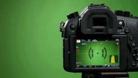 Foreground camera shoots green screen clous up Stock Footage 99549474