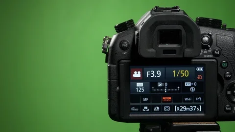 Foreground camera shoots green screen clous up Stock Footage 99549976