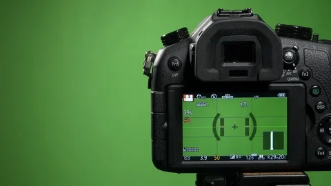 Foreground camera shoots green screen clous up Stock Footage 99550066