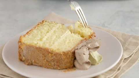 Foreground. Female hands break off a piece of sponge cake with chocolate cream Stock Footage 146479880