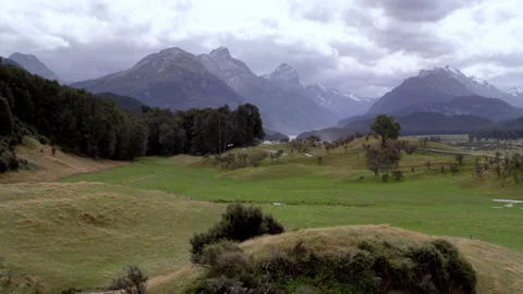 Foreground hill with background mountain view Stock Footage 159803542