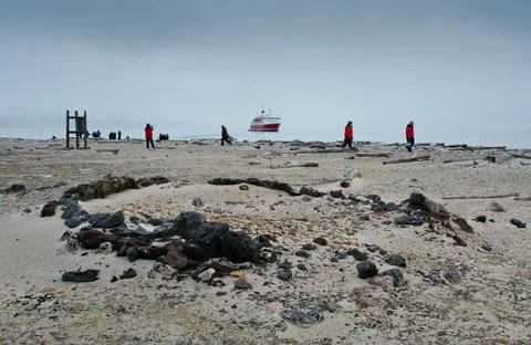 In the foreground remains of an old fire circle from whaling days. Stock Photos