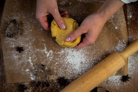 In the foreground is a table with baking parchment lying on it, on which there Stock Photos