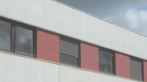 Foreground Traffic in Front of Office Window Stock-Footage 325263159