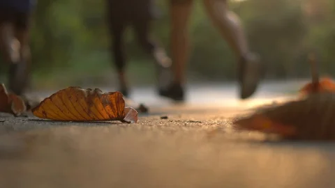 Foreground video of runner run along rural street Video stock 86515184