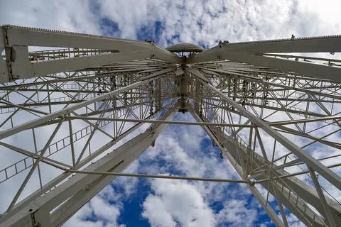 In the foreground a white metal structure, the structure is a wheel for the.. Stock Photos