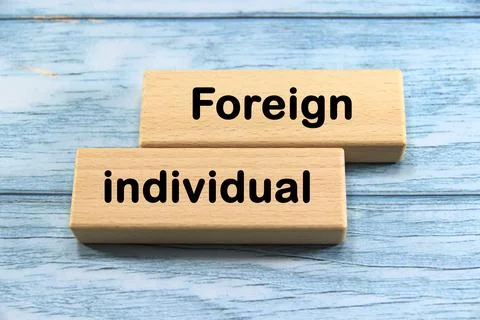 "Foreign individual" text or message short word english letter on wooden cu.. Stock Photos