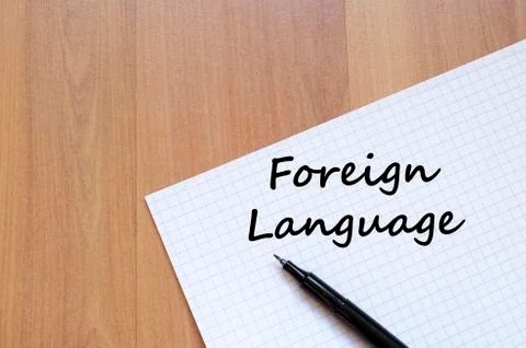 Foreign language write on notebook Stock Photos