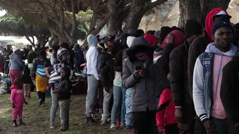 Foreign nationals queue for repatriation Stock Footage 339501363