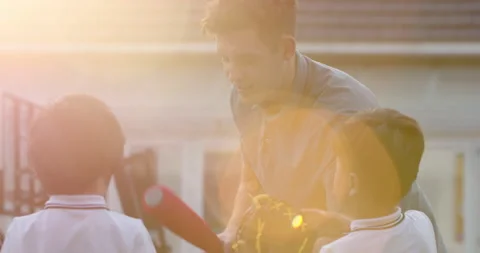 Foreign teacher teaching children baseball,4K Stock Footage 146873006