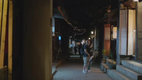 Foreign tourists visiting the old town of Lijiang Stock Footage 150643772