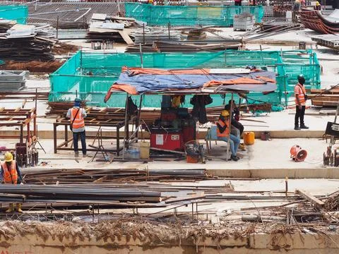 Foreign workers are working in a construction site Stock Photos