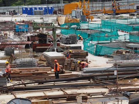 Foreign workers are working in a construction site Stock Photos