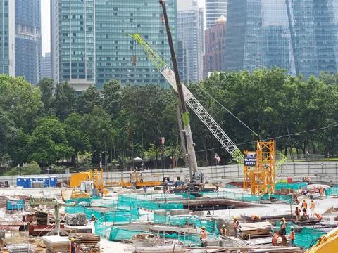 Foreign workers are working in a construction site Stock Photos