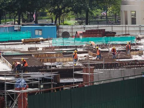 Foreign workers are working in a construction site Stock Photos