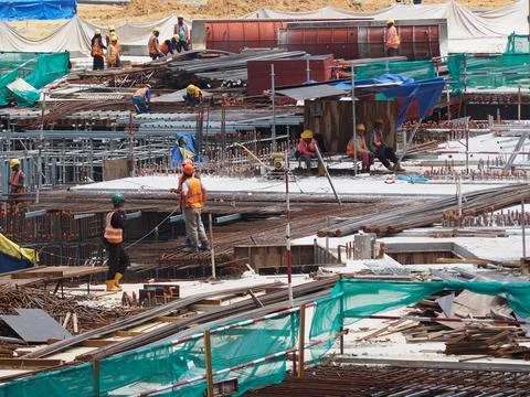 Foreign workers are working in a construction site Stock Photos
