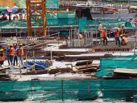 Foreign workers are working in a construction site Stock-Fotos