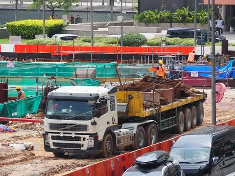 Foreign workers are working in a construction site Foto stock