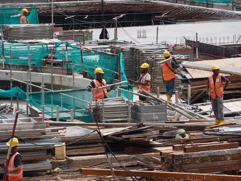 Foreign workers are working in a construction site Stock Photos