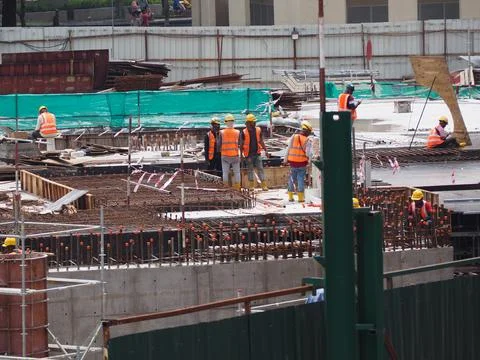 Foreign workers are working in a construction site Stock-Fotos