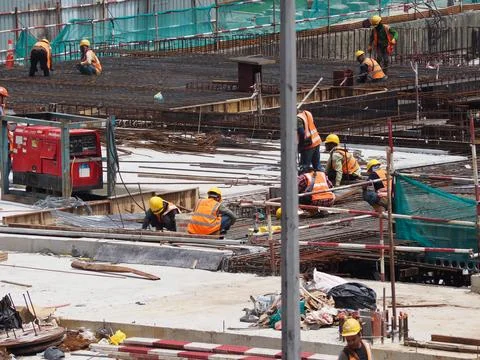 Foreign workers are working in a construction site Stock-Fotos