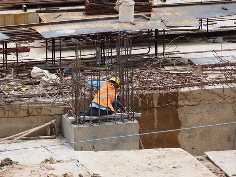 Foreign workers are working in a construction site Stock-Fotos