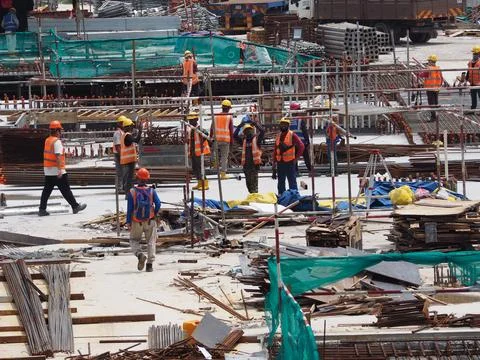Foreign workers are working in a construction site Stock-Fotos