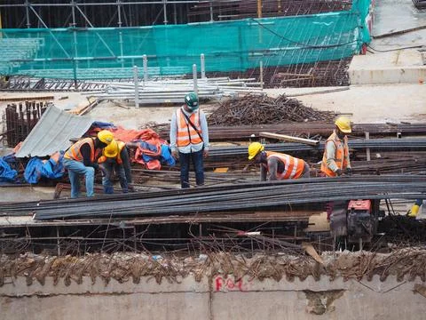 Foreign workers are working in a construction site Stock-Fotos
