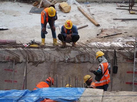 Foreign workers are working in a construction site Stock-Fotos